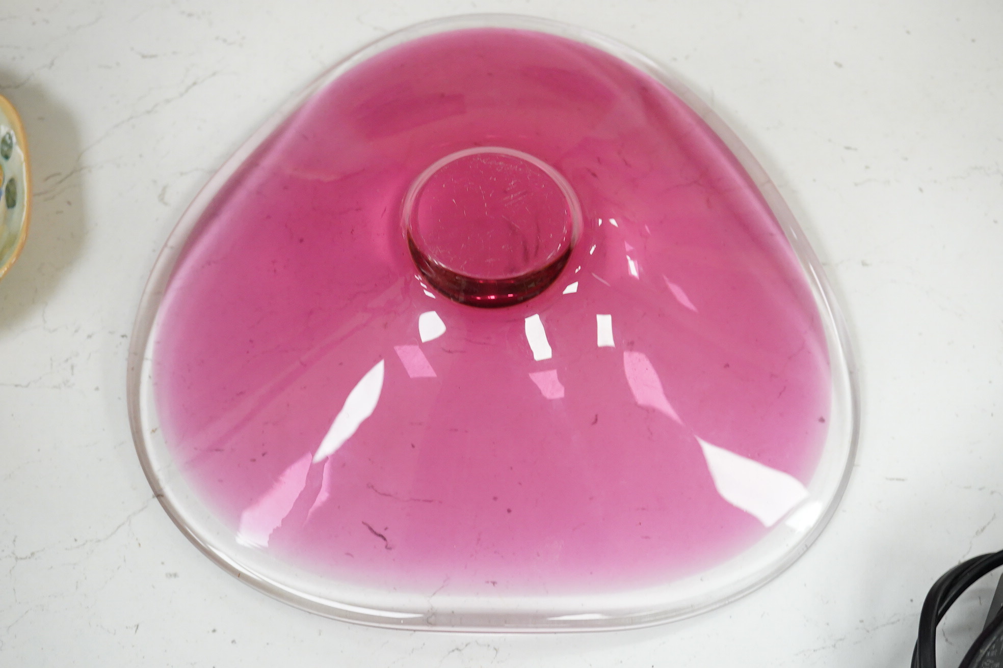 Michael Magyar, a cranberry glass dish, signed to the base, 26cm wide